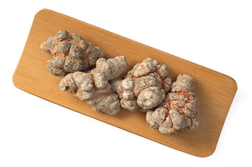 Dried notoginseng in the wooden bowl,  isolated on white background, top view