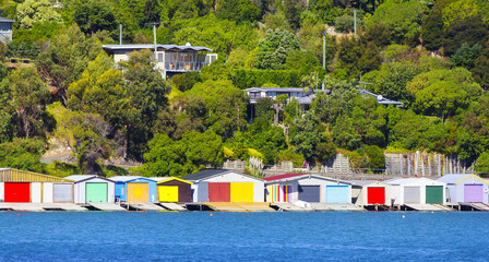Fototapeta na wymiar Colorful Boat Sheds at Duvauchelle, Akaroa Harbour on Banks Peninsula in South Island, New Zealand