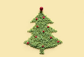 Christmas tree made of sprinkles on color background