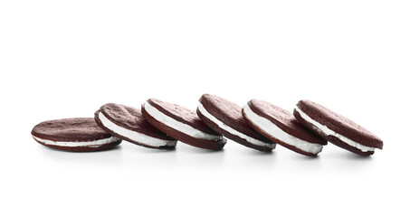 Tasty chocolate cookies with cream on white background