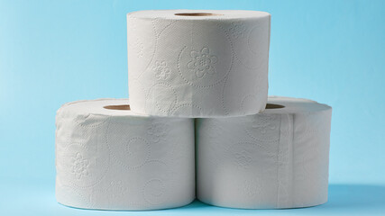 White toilet paper on blue color background. Toilet paper article. Textures on cotton paper.