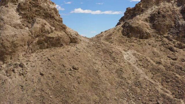 Amazing Trona Pinnacles, panning drone shot.View Of Trona  Aerial side panning of the desert with high rock structures on a sunny day.
