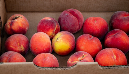Fresh peaches are on display for purchase at a Farmers Market in Oregon