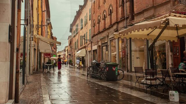 FERRARA, ITALY - Jul 30, 2020: FERRARA, ITALY 30 JULY 2020: Time Lapse of Evocative view of a street in the historic center of Ferrara