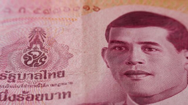 Monogram King of Thailand Maha Vajiralongkorn on red 100 baht banknote. THB paper bill, new tai money