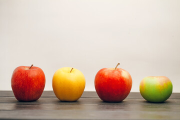 Fruit apples in a row on the table