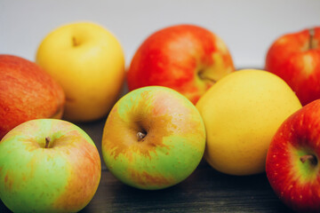 Beautiful multi-colored apples on the table