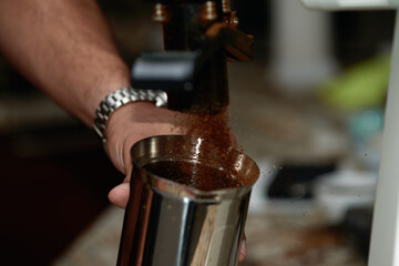 Coffee grinder closeup during operation