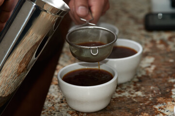 Coffee poured over and filtered on cup