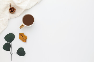 Autumn composition, coffee cup. dried leaves. and pine cones on white background. Flat lay, top view with copy space