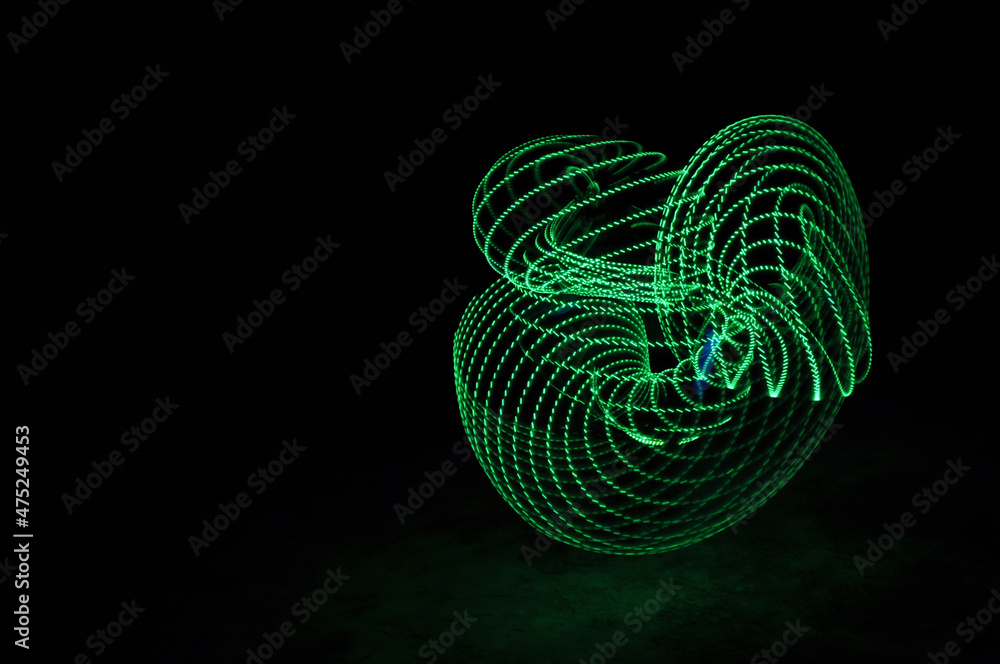 Poster digital render of abstract green swirls and curves on a black background
