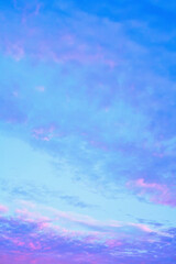 Beautiful morning cloudy sky, haze and light cirrus clouds illuminated by the rays of early dawn