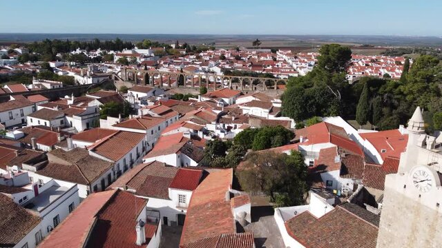 Aerial shot of Church in Serpa flying towards an aqueduct in the south of Portugal.