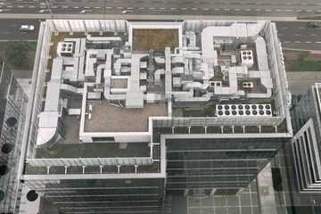 Aerial view of HVAC system on the roof top. Complex air conditioning system with pipes on the top...
