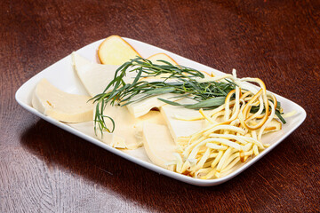 Caucasian tradition cheese plate served herbs
