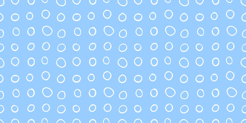 Fototapeta na wymiar Spotty abstract vector seamless pattern. Random rings, circles, spots, stains, bubbles, stones in row. Design for fabric, funny cute print. Repetitive graphic background and texture.