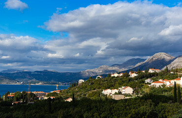 Fototapeta na wymiar Mountains on the Adriatic coast. Settlements on the shore.