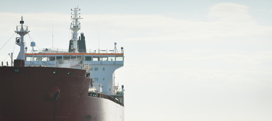 Large red cargo ship (oil chemical tanker, 184  meters length) sailing in the Baltic sea. Freight...