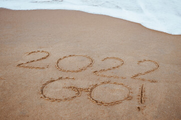 Start and go 2022 on the sand at the beach to show life ahead next year. background