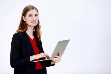 Portrait studio shot millennial Caucasian happy friendly female employee secretary businesswoman standing smiling holding typing laptop computer remote working browsing internet on white background