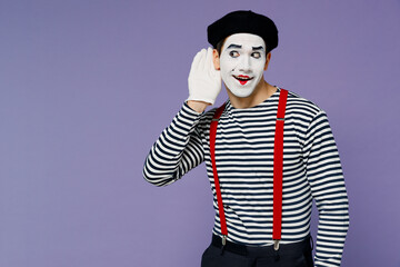 Curious nosy charismatic fun young mime man with white face mask wears striped shirt beret try to hear you overhear listening intently isolated on plain pastel light violet background studio portrait. - obrazy, fototapety, plakaty