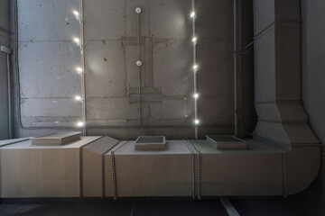 Abstract loft interior of concrete grey ceiling with air ventilation and security camera. Interior architecture and ceiling design of industrial loft building decorated with modern lamps