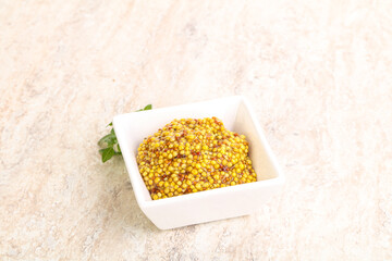 Grain mustard sauce in the bowl