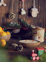 One candle in a coconut shell on the background of a Christmas decor.