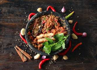 A spicy and delicious Indonesian chili sauce, with fresh basil leaves makes eating even more...