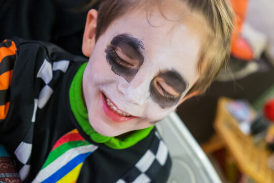 Child with painted face for carnivals