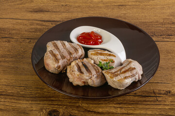 Grilled pork tenderlion with tomato sauce