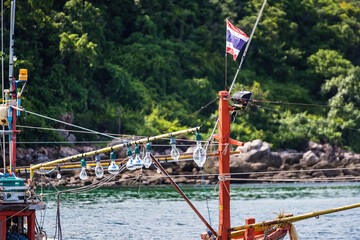 Chon Buri, Thailand - October, 02, 2021 : Fishing boat in the sea at Tawaen Beach, Koh Larn, Chonburi, Thailand.