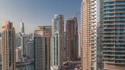 Fototapeta na wymiar Aerial view on Dubai Marina skyscrapers and the most luxury yacht in harbor timelapse, Dubai, United Arab Emirates