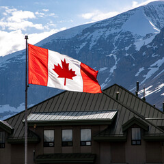 Canadian flag and Canadian rocky mountains