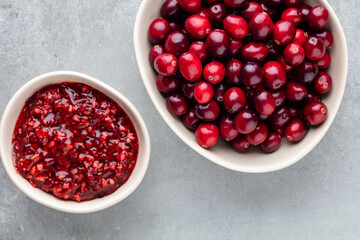 Red berries on a dark background. cranberries in a bowl.