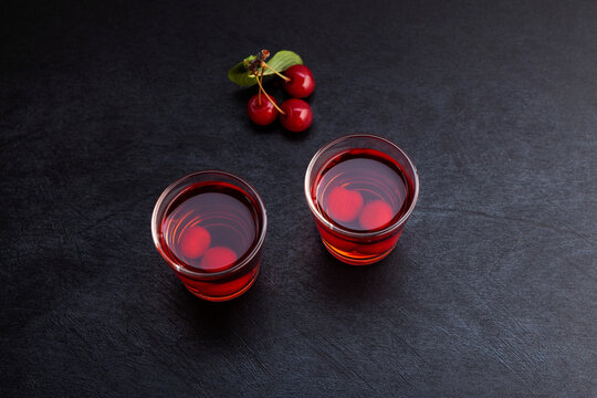 Ginjinha or Ginja - Tradition Portuguese liqueur made by infusing ginja berries (sour cherry, Prunus cerasus austera, Morello cherry) in alcohol (aguardente) and adding sugar