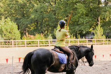 Equestrian archer riding a horse