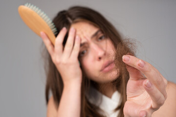 Woman with hair loss problem. Portrait of Young girl with a bald. Head shot of a nervous girl with...
