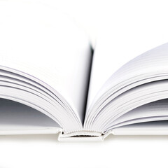 Open blank notebook, book with white sheets on white background. Studio shot.