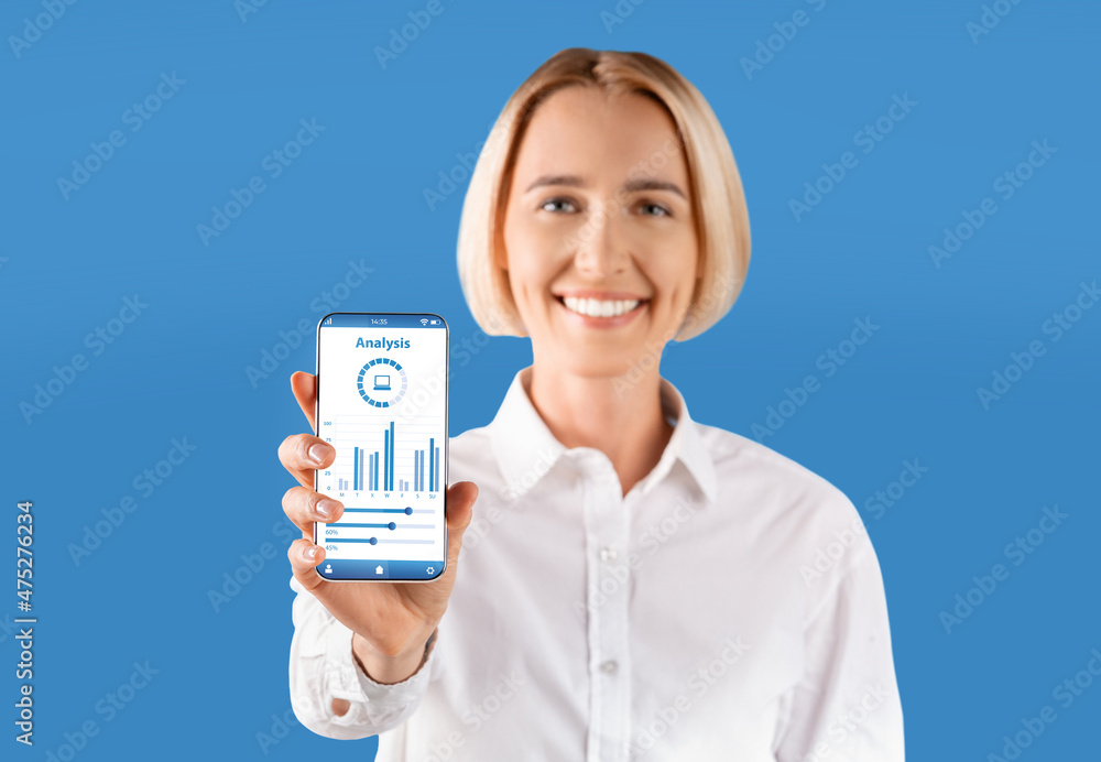 Aufkleber Cheerful woman showing smartphone with graphs and diagrams on screen