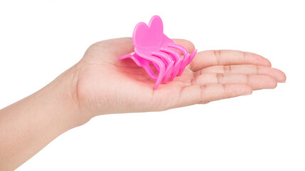 hand holding plastic hair clip isolated on white background