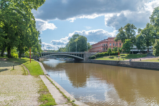 Summer view on Aura river with bridge in city center of Turku.