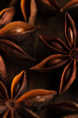 macrophotography of star anise on a wooden background. brown spice star anise is close