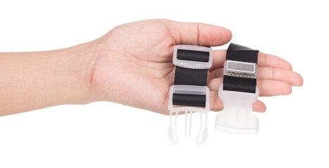 Hand holding Set of luggage connector straps isolated on white background.