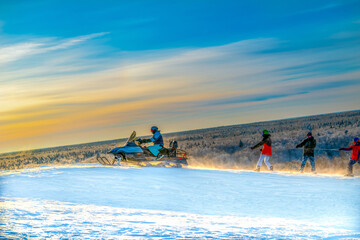 Cherepovets, Russia December 11, 2021 A group of skiers, snowboarders in soft focus climbing the...