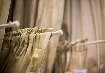 beige curtains in the shop window