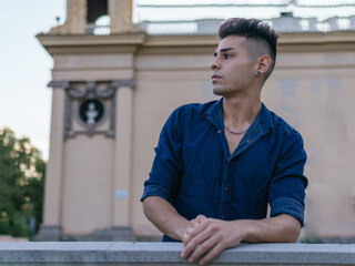 A latin argentinian guy looking to the right