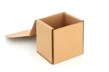 Cardboard box cube shaped container with lid open on white background. Recycled eco friendly packaging, design element. Copy space.