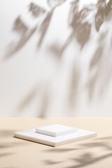 Abstract minimal nature scene - empty stage and square podium on beige background and soft shadows...