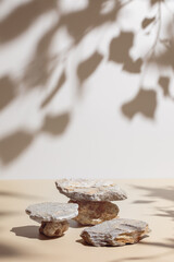 Abstract minimal nature scene - empty stage and composition of stones on beige background and soft...